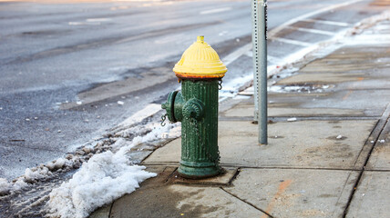 urban scene with a red fire hydrant standing tall on a sunlit street corner, symbolizing safety and...