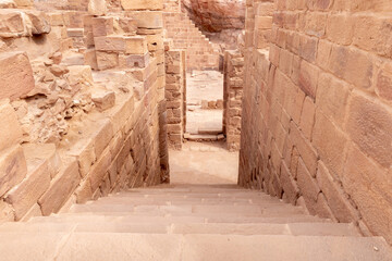 Stone steps leading down from the main hall in the Roman part of the Nabataean Kingdom of Petra in the Wadi Musa city in Jordan © svarshik