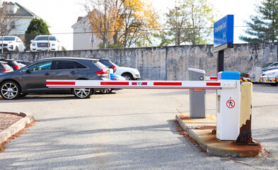 closed parking lot gate, representing barriers, access control, and restricted entry, in a modern...