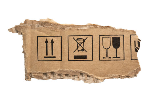 Torn cardboard paper with packaging symbols