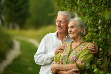 Beautiful mature couple in the summer park