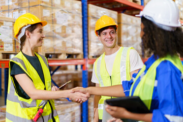 A diverse team of warehouse personnel is conducting a comprehensive stock inventory using laptop...