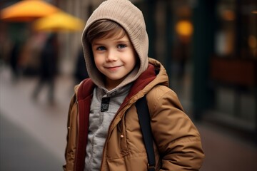 Portrait of a cute little boy in a warm coat and hat.