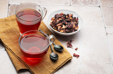 Glass cup of hot hibiscus tea.