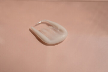 A smear of cream on a light background. Beauty concept.