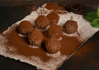 Chocolate truffles sprinkled with cocoa powder