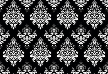Wallpaper in the style of Baroque. Seamless vector background. White and black floral ornament. Graphic pattern for fabric, wallpaper, packaging. Ornate Damask flower ornament