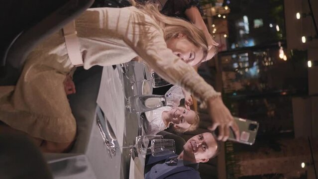 Four-Member Family Having Great Time in a Restaurant, Make Selfie Photo
