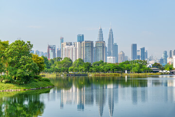 Fototapeta na wymiar Kuala Lumpur skyline. Scenic lake in a city park