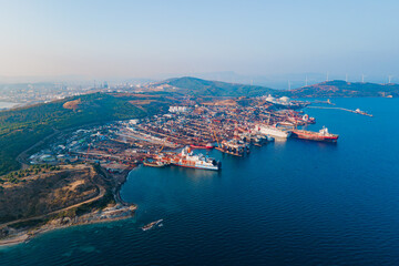 Fototapeta premium Ship breaking yard, demolition yard where old cargo ships, tankers in Turkey. Aerial view