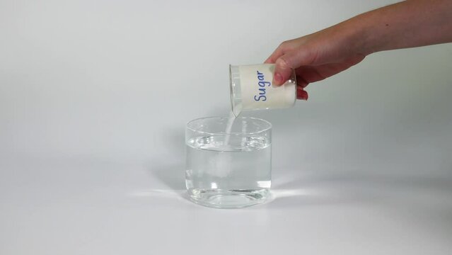 Pouring Sugar into Water Demonstration