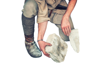 Working in a quarry holding stones, isolated on a white background. The Mason chooses a white limestone stone for production.
