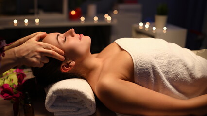 Girl doing relaxation head massage in beauty salon. Unforgettable sensations lightness and...
