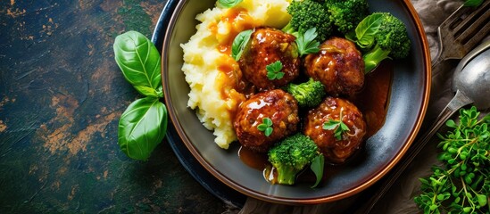 meat balls served with broccoli and mashed potatoes. Copy space image. Place for adding text or design
