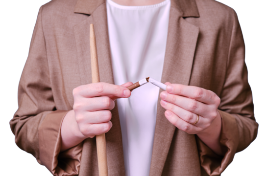 Woman teacher holding broken cigarette on studio isolated on a white background, close-up - Powered by Adobe