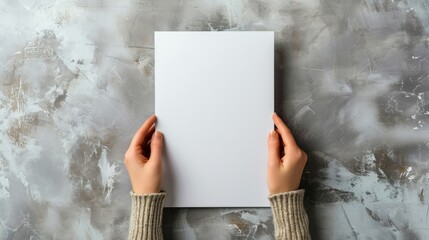Female hands holding blank magazine gray background design template. Mockup image   