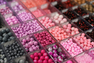 Colorful beads in the organizer. Creation