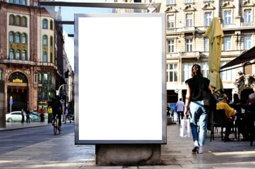  blank digital ad panel. billboard display. empty white lightbox sign at busstop. mockup template. city transit station. urban street setting. outdoor advertising. © Istvan