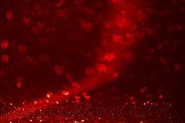 red background with heart-shaped highlights. Beautiful holiday background, background for postcards