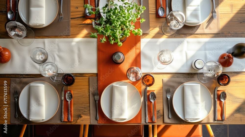 Poster A picture of a table set with place settings and utensils. Perfect for showcasing elegant dining experiences or for use in restaurant advertisements