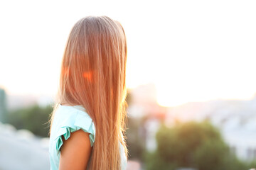 Outdoors portrait of beautiful young blond woman