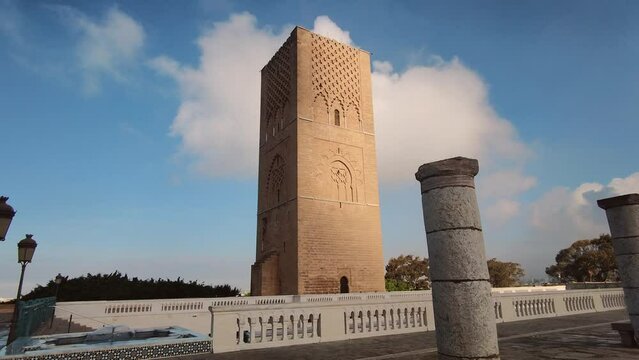 A low-angle perspective view of the Hassan Mosque can be seen against the backdrop of the sky in Rabat, Morocco