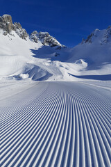 Perfectly groomed empty ski piste