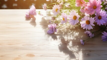 Pink daisies with delicate petals casting soft shadows on a rustic wooden table.