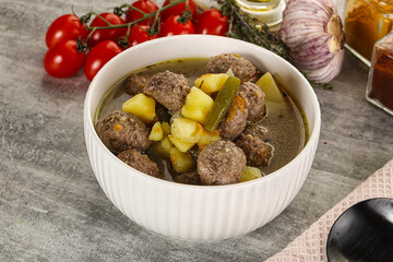Soup with meatball and potato
