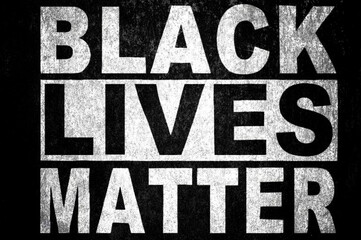 Inscription Black Lives Matter on black metal surface. Black Lives Matter lettering on metallic texture