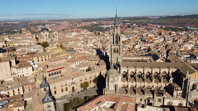 Toledo, Spain: Aerial drone footage of the famous Toledo cathedral in the medieval old town in the Castilla-La Mancha in central Spain. Shot with a tilt down motion