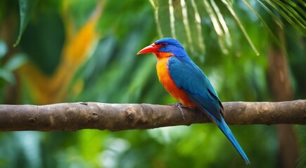 Naklejka premium colored beautiful bird sitting on the tree in the jungle, colored wild bird, colored wild bird sitting on the branch of tree in jungle