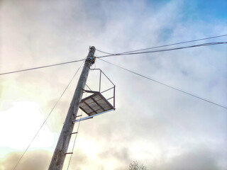 Old pole with wires against the sky. Electric transmission line. Eco-friendly energy