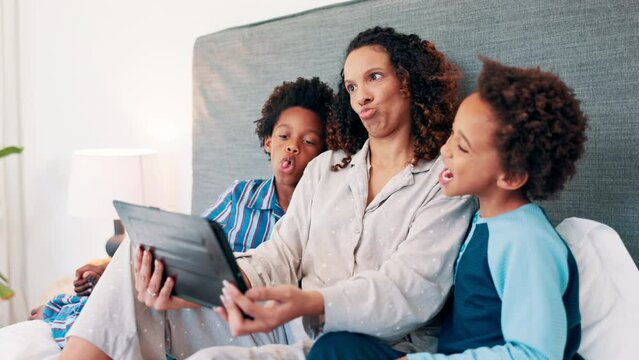 Selfie, tablet and mother with kids on a bed with crazy, expression or funny faces at home. Love, family and African mom with children in a bedroom for digital photography, profile picture or memory