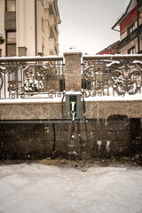 Car electric charging station covered with snow. Electric car concept