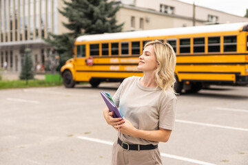 a woman near a school bus