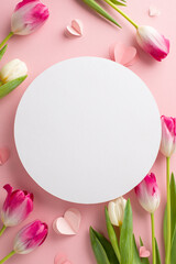 Blossoming love: Vertical top view stunning array of tulips and heart embellishments on pastel pink...