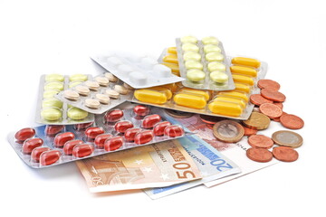 Pills on euro banknotes, money and health. - 717670955
