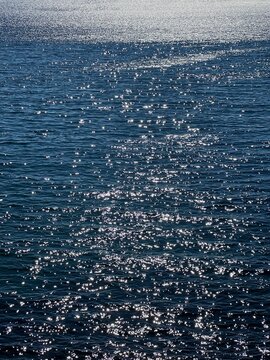 Blue glittering sea water surface