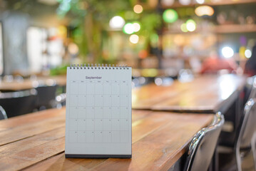 Calendar desk on table. Desktop Calender for Planner to plan wedding agenda, timetable, appointment, organization, management each date, month on office table. 2024 Calendar Concept.