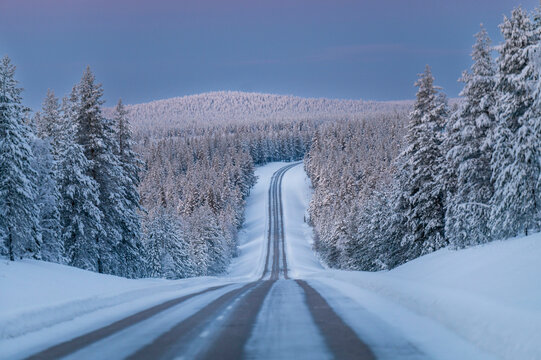 Lapland in winter with large amount of snow during colourful sunset