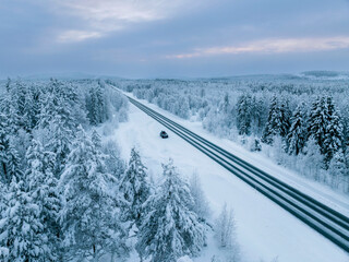 Aerial view of beautiful winter landscape in Lapland during sunset.