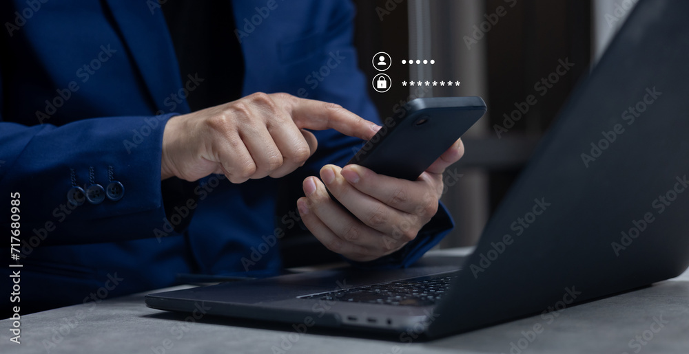 Wall mural close up businessman use smartphone and type username and password to access private account of offi