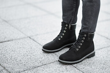 Isolated outdoor street photo of a generic pair of boots. Walk the city streets in style with these...