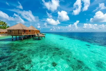 Fototapeten Tropical paradise. Luxury panoramview on Maldives resort on seascape background. Bungalow, villas on beautiful exotic beach on the ocean. Spa, leisure, concept Ai © Khalif