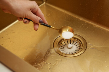 Cleaning kitchen sink with bakIng soda to keep sinks draining well and prevent clogs. Safe,...