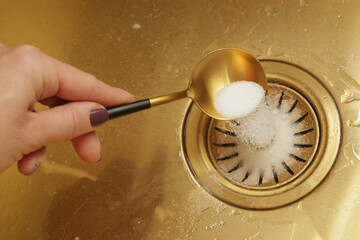 Cleaning kitchen sink with bakIng soda to keep sinks draining well and prevent clogs. Safe,...
