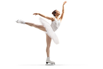 Full length profile shot of a female ice figure skater performing