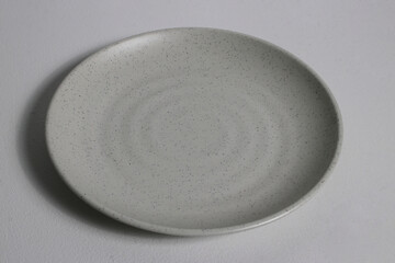 Fototapeta na wymiar Empty food grade plate isolated on a grey background