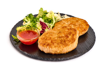 Fried pork schnitzels in breadcrumbs, isolated on white background.